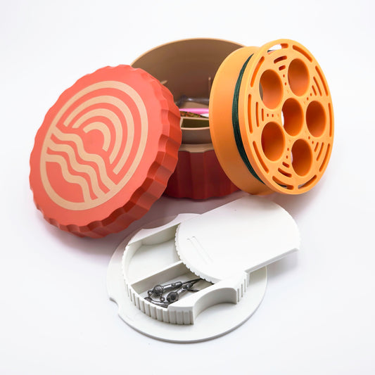 Three colorful fishing reel cases on a white background